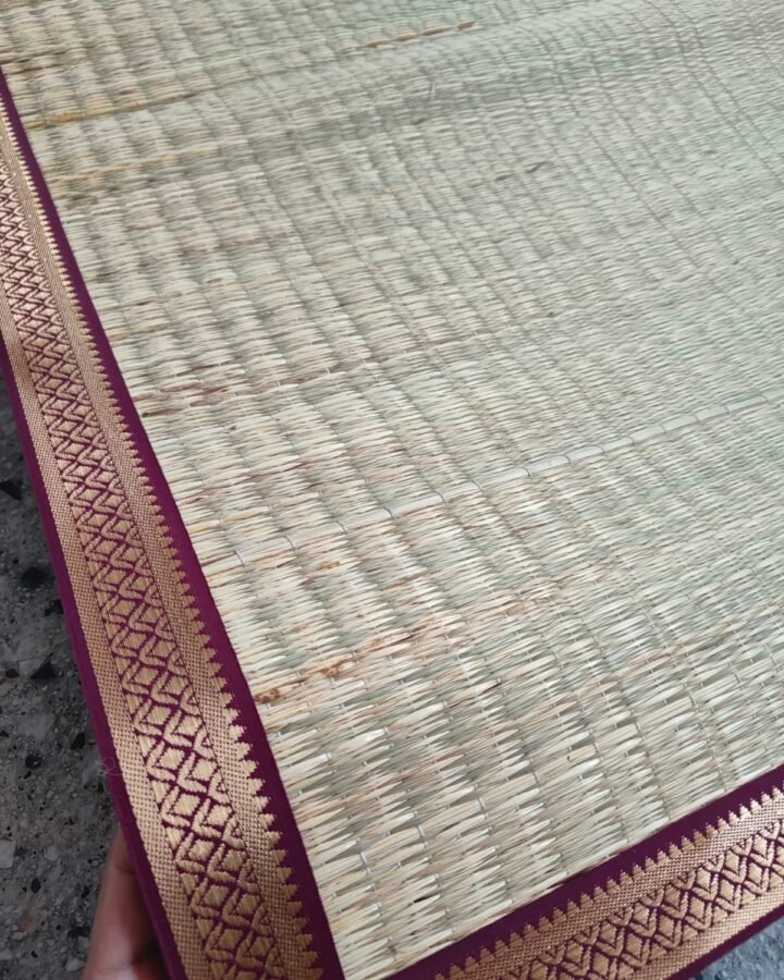 A cora mat backdrop styled for a festival setup
