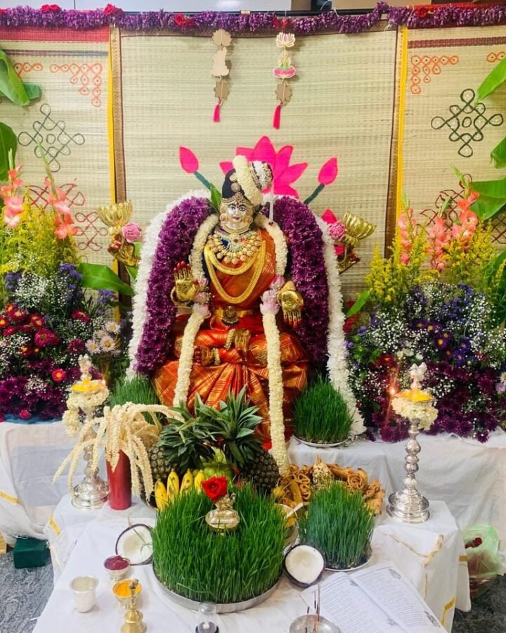 A cora mat backdrop styled for a home pooja